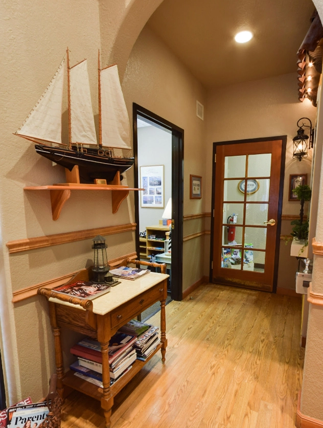 Inside Venetian Pointe Dentistry. Venetian-themed hallway with sailboat décor, Orlando, FL