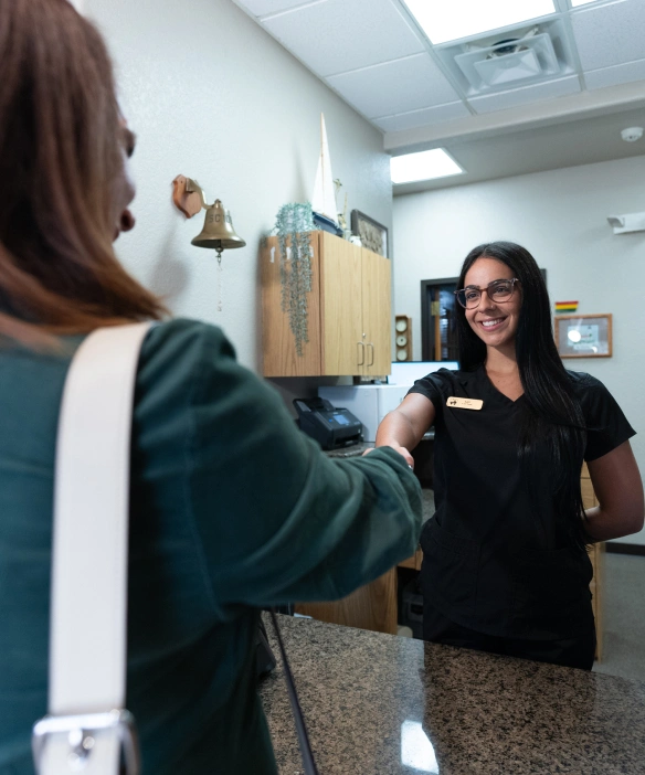 Venetian Pointe Dentistry staff greeting a patient at the front desk